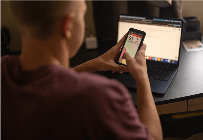 Eversense diabetes user uses Eversense 365 CGM system to manage alerts and notifications