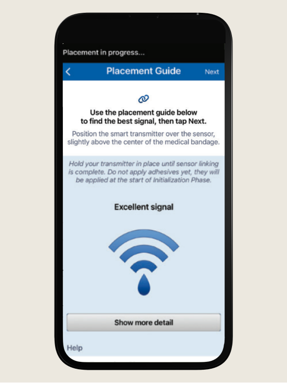 Smartphone shows a medical app's placement guide, featuring signal instructions and a "Show more detail" button below. 