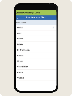 A smartphone screen displays a "Low Glucose Alert" page with ringtone options